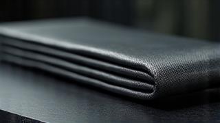 Close-up of Toray and Hexcel carbon fiber fabric swatches