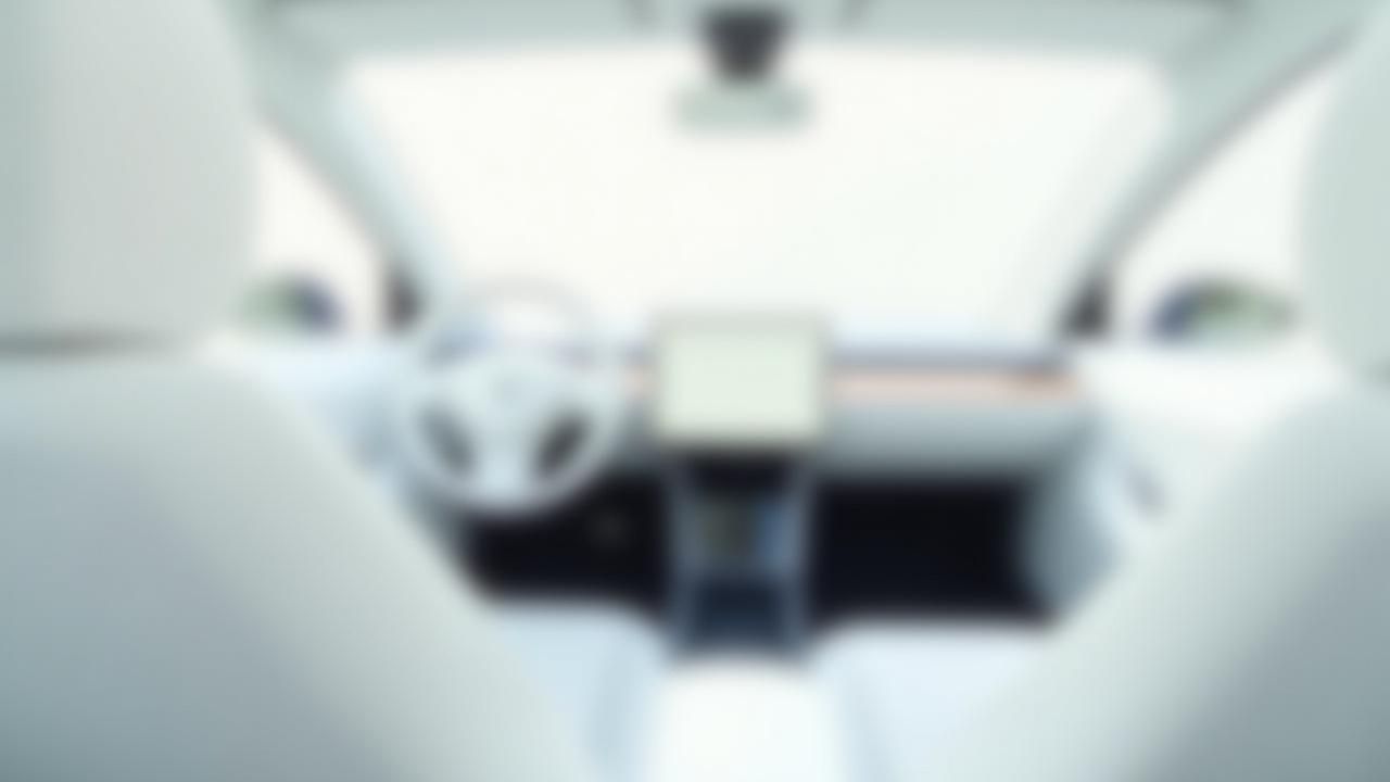 Before: Tesla Model 3 white interior with standard trim